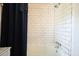 Close-up shot of a shower showcasing its clean white subway tile at 1495 Longwood Sw Dr, Marietta, GA 30008