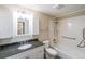 Bathroom features a granite countertop, white cabinets, and a shower with grab bars at 1800 Clairmont Lk # A719, Decatur, GA 30033