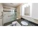 Bathroom with a walk-in shower, tiled floor, and white cabinets create a clean, modern look for relaxation at 1800 Clairmont Lk # A719, Decatur, GA 30033