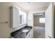 Well-lit bathroom has a granite countertop and a mirror cabinet, offering a perfect blend of style and functionality at 1800 Clairmont Lk # A719, Decatur, GA 30033