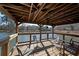 Waterfront deck featuring a wood ceiling and metal guardrails, with comfortable outdoor seating and lake views at 1800 Clairmont Lk # A719, Decatur, GA 30033