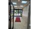 Well-lit hallway with mailboxes and a view of a garden through the glass doors at 1800 Clairmont Lk # A719, Decatur, GA 30033