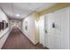 Hallway leading to unit with doors and wall decor at 1800 Clairmont Lk # A719, Decatur, GA 30033