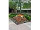 Lush landscaping surrounds this building, adding color and beauty to the exterior of the home at 1800 Clairmont Lk # A719, Decatur, GA 30033