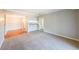Neutral living room with an open layout that flows into the dining area and kitchen, creating a welcoming space at 1800 Clairmont Lk # A719, Decatur, GA 30033