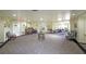 Spacious lobby with ample seating areas, tables, and decorative wall art at 1800 Clairmont Lk # A719, Decatur, GA 30033