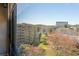 Scenic view from the unit featuring lush trees, surrounding buildings and a bright blue sky at 1800 Clairmont Lk # A719, Decatur, GA 30033