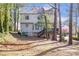 Spacious backyard featuring a deck, walkout basement and natural landscaping at 2542 Ashridge Ct, Lawrenceville, GA 30043