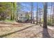 Large wooded backyard with a deck perfect for enjoying nature and relaxing outdoors at 2542 Ashridge Ct, Lawrenceville, GA 30043