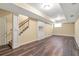 Finished basement featuring wood-look flooring, recessed lighting, and built-in shelving at 2542 Ashridge Ct, Lawrenceville, GA 30043