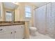 Well-lit bathroom featuring a granite vanity and shower/tub combo at 2542 Ashridge Ct, Lawrenceville, GA 30043