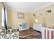 Cozy Bedroom with a crib, accent chair, and neutral decor at 2542 Ashridge Ct, Lawrenceville, GA 30043