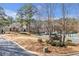 Community clubhouse with lush landscaping, signage and ample parking at 2542 Ashridge Ct, Lawrenceville, GA 30043