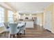 Dining area with wood floors and view into the kitchen at 2542 Ashridge Ct, Lawrenceville, GA 30043