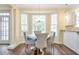Dining area featuring wood floors, lots of windows, and chandelier lighting at 2542 Ashridge Ct, Lawrenceville, GA 30043