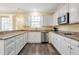 Bright kitchen with white cabinets, granite countertops and stainless steel appliances at 2542 Ashridge Ct, Lawrenceville, GA 30043
