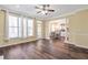 Living room with wood floors and view into dining area and kitchen at 2542 Ashridge Ct, Lawrenceville, GA 30043