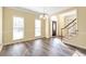 Bright room with hardwood floors, a chandelier, and a view of the front door at 2542 Ashridge Ct, Lawrenceville, GA 30043