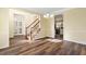 Open-concept living area with hardwood floors, staircase, and a dining area at 2542 Ashridge Ct, Lawrenceville, GA 30043