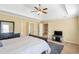 Light-filled suite featuring a tray ceiling, TV, and access to additional rooms at 2542 Ashridge Ct, Lawrenceville, GA 30043