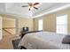 Spacious suite with a tray ceiling, carpet, and an attached bathroom at 2542 Ashridge Ct, Lawrenceville, GA 30043
