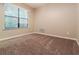 Comfortable bedroom with natural light and neutral carpet, offering a peaceful retreat at 2895 Wildflower Ln, Snellville, GA 30039