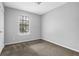 Inviting bedroom features a window, light walls and carpet at 2895 Wildflower Ln, Snellville, GA 30039