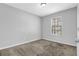 Cozy bedroom features light walls, plush carpet and window for natural light at 2895 Wildflower Ln, Snellville, GA 30039