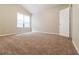 Bright bedroom featuring a large window and neutral carpet, creating a serene atmosphere at 2895 Wildflower Ln, Snellville, GA 30039