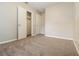 Neutral bedroom featuring soft carpet, closet and white doors adding a calm and inviting atmosphere at 2895 Wildflower Ln, Snellville, GA 30039