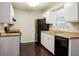 Functional kitchen with modern appliances and ample storage, ideal for culinary enthusiasts at 2895 Wildflower Ln, Snellville, GA 30039