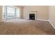 Cozy living room with a fireplace and large windows, perfect for relaxing and entertaining at 2895 Wildflower Ln, Snellville, GA 30039