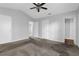 Light and airy main bedroom features gray walls, carpet, and ensuite bathroom with shower at 2895 Wildflower Ln, Snellville, GA 30039
