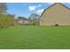 Spacious backyard showcasing a lush green lawn, offering ample space for outdoor enjoyment and potential landscaping at 864 Oakhill Ct, Stone Mountain, GA 30088