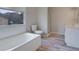 Bathroom featuring a combination tub/shower, wood-look flooring, and a white vanity at 864 Oakhill Ct, Stone Mountain, GA 30088