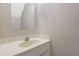 Functional bathroom with a standard sink, vanity, and a wall mirror at 864 Oakhill Ct, Stone Mountain, GA 30088