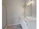 Bathroom with a shower and a white vanity, complemented by wood-look flooring at 864 Oakhill Ct, Stone Mountain, GA 30088