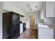 Functional kitchen with essential appliances, wood floors, and a standard layout at 864 Oakhill Ct, Stone Mountain, GA 30088