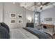 Bedroom with stylish desk, exposed ceiling and natural light at 878 Peachtree Ne St # 535, Atlanta, GA 30309