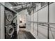 Stacked washer and dryer next to a walk-in closet at 878 Peachtree Ne St # 535, Atlanta, GA 30309