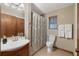Full bathroom featuring a sink, toilet, shower with curtain, and towel rack at 4062 Wildflower Ln, Tucker, GA 30084