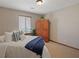 Bedroom featuring a twin bed, wooden wardrobe, and window at 4062 Wildflower Ln, Tucker, GA 30084