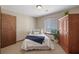 Cozy bedroom with a twin bed and wooden wardrobe at 4062 Wildflower Ln, Tucker, GA 30084