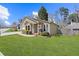 Charming single-story home featuring manicured lawn, attached garage and inviting front entrance with a decorative wreath at 4062 Wildflower Ln, Tucker, GA 30084
