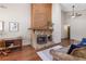 Bright living room featuring hardwood floors, a stone fireplace, and large window at 4062 Wildflower Ln, Tucker, GA 30084