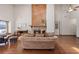 Open-concept living room featuring vaulted ceilings, hardwood floors, and a stone fireplace at 4062 Wildflower Ln, Tucker, GA 30084