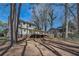 Expansive backyard view showcasing the home's exterior and mature trees at 4113 Stutz Ct, Tucker, GA 30084