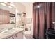 Traditional bathroom featuring single sink vanity and tub/shower combo with curtains at 4113 Stutz Ct, Tucker, GA 30084