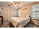 Cozy bedroom featuring neutral tones, complemented by plush bedding and natural light at 4113 Stutz Ct, Tucker, GA 30084