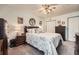 Bedroom with ceiling fan, neutral walls, and comfortable queen-sized bed at 4113 Stutz Ct, Tucker, GA 30084